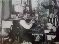 A German family decorating a Christmas Tree
