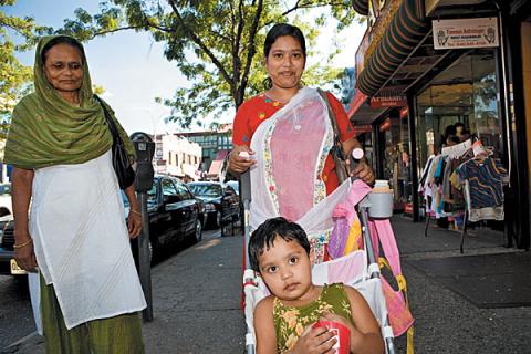 Photograph: Sophia Wallace, Time Out New York. This photograph depicts a typical South Asian scene in Jackson Heights. A grandmother, mother, and daughter (the old and new generation) are seen in traditional attire, shopping on the streets.
