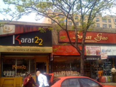 Two jewelery stores right next to each other: Karat 22 and Sonar Gao. The juxtaposition of stores selling the same merchandise may seem at first a foolish business tactic because of the emphasis placed on location in many American business models. However, stores who employ this method in Jackson Heights are able to not only avoid foreclosure but also find themselves thriving amidst the competition. The real winners in this scenario are the customers who can easily compare prices and find the best deals on merchandise without having to travel all over the city