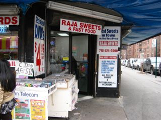 DVD vendor outside a restaurant in Jackson Heights