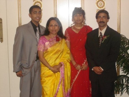 Jeffin Mathew and his family at a celebration. The women, responsible for the retention of culture, are in traditional Indian dress, while the men are wearing contemporary American suits. This is symbolic of the mixture of the two cultures. Image (c) Jeffin Mathew.