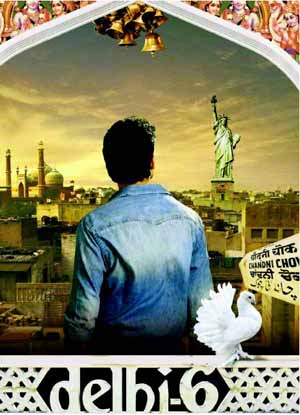 Movie poster for Dehli 6, a recent release. The poster depicts the Statue of Liberty as well as the Taj Mahal representing the man, Roshan's ties to each as the American born son of an Indian immigrant.