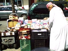A vendor organizing his stand