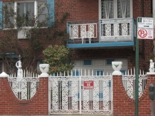 A house in Astoria exhibiting Greek style sculpture