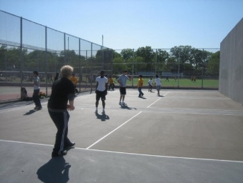 Students play handball in gym class