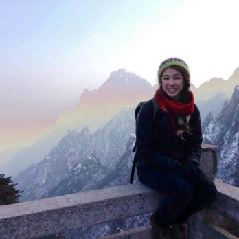 Macaulay student on mountaintop during study abroad trip